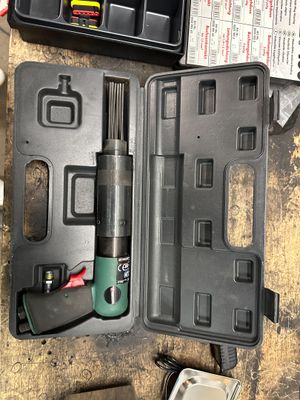 an image of a tool kit sitting on top of a wooden table