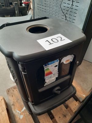 a trash can sitting on a pallet in a warehouse