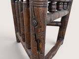 a wooden chair that is made of wood and has a seat made out of wood