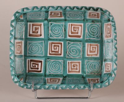 a blue and brown plate with squares and squares on it