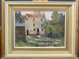 an oil painting of a house on a easel in front of a blue wall