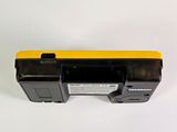 a close up of a yellow and black battery case on a white surface