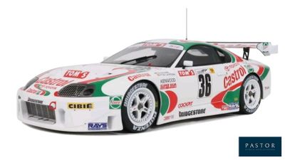 the car is white and green with a red and white stripe