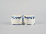 pair of blue and white mugs on a grey background