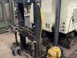 a machine that is sitting in a room with a lot of equipment
