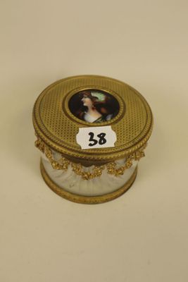 a gold box with a picture of a woman on it