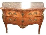 a marble top on a wooden chest of drawers