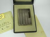 a box with a lot of silver coins inside of it