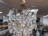 a chandelier hanging from a ceiling in a room