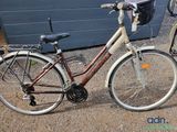 a bicycle that is parked next to a building