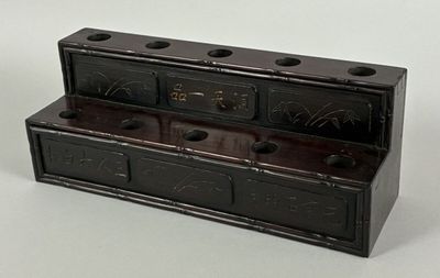 a small wooden box with a clock on it