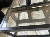 a glass table with a book on top of it