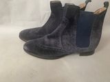 a close up of a pair of blue boots on a white background