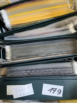 a lot of folders in a box with labels on them