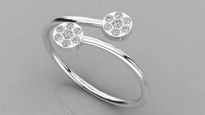 a white gold ring with two diamonds on top of it