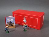 toy figurines of two men in blue uniforms and a red box