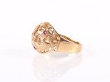 an image of a gold ring with a ruby stone in the center