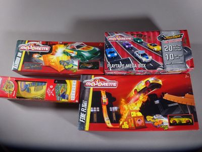 three toy cars are sitting on a table next to each other