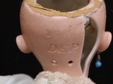 a clay head with a hole in the middle of it