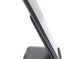 a cell phone that is sitting on top of a stand