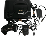 une console de jeux avec une manette et un chargeur