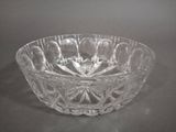 a glass bowl that is sitting on a table