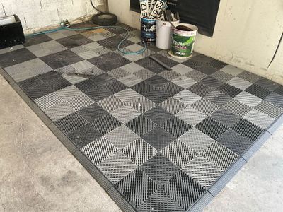 a black and white checkered floor in a garage