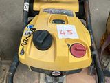 a small yellow machine that is sitting on the ground