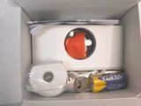 a box with a toilet and a roll of toilet paper in it