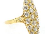 a close up of a gold ring with a cluster of diamonds