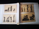 a book with pictures of statues in it on a table