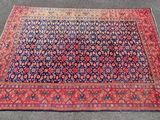 an oriental rug is laying on the floor in a room