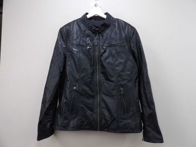 a black leather jacket hanging on a hanger in front of a white wall