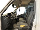 the interior of a white van with a yellow sticker on the front seat