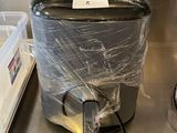 a trash can that is wrapped in plastic on the counter