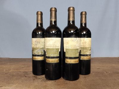 three bottles of wine sitting on top of a wooden table