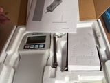 an electronic device in a box on a table