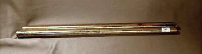 a metal tube that is laying on a white sheet