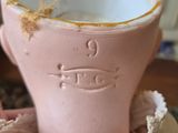 a pink cup that is sitting on top of a table