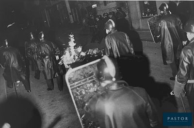an old black and white photo of a group of people standing around a christmas tree