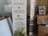 a sign that says builtex next to a refrigerator in a room