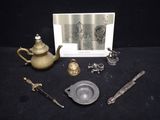 a picture of a collection of antique items on a table