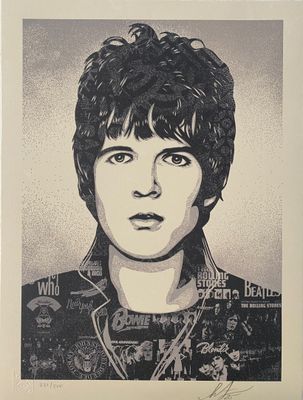 a black and white photo of a young man with hair