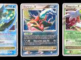 three different pokemon cards are shown in a row on a black background