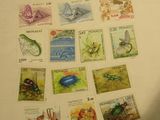 a lot of stamps that are on the table
