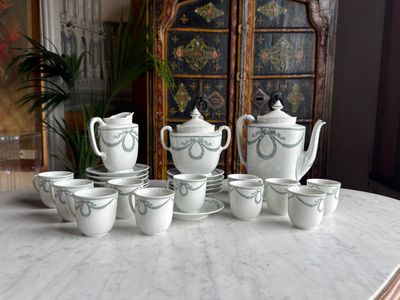 many cups and saucers sitting on a marble table