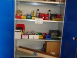 a blue cupboard with a lot of items in it