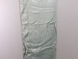 a white hanger on a wall with a green cloth