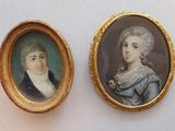 two miniature portraits of a man and a woman in a gold frame