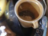 a cup of coffee sitting on top of a table